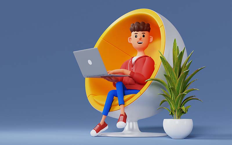A man sitting in an egg chair, engrossed in his laptop.